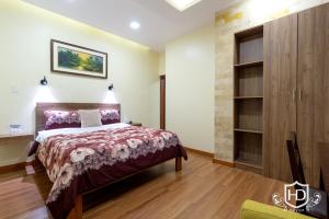 سرير أو أسرّة في غرفة في Hotel David