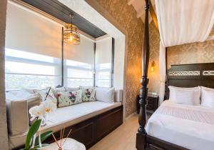a bedroom with two beds and a window at PROVENCE MANSİON ALAÇATI in Alacati