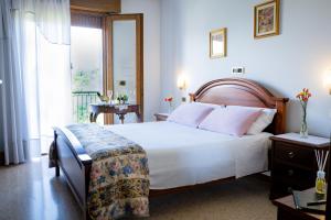 Postel nebo postele na pokoji v ubytování Hotel Da Gigi + 37 fotografií