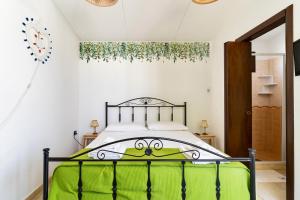 Giường trong phòng chung tại B&B Rosa Dei Venti