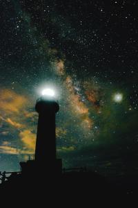 a lighthouse with a light on top of it at night at Joya in Ishigaki Island