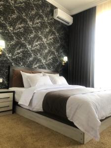 Кровать или кровати в номере Sabrina Hotel