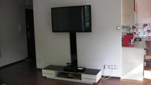 En tv och/eller ett underhållningssystem på Premium Apartment