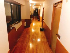 a hallway of a hospital with a hard wood floor at Joya in Ishigaki Island