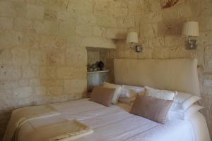Posteľ alebo postele v izbe v ubytovaní Trulli La Pietraia