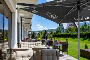 Reštaurácia alebo iné gastronomické zariadenie v ubytovaní Hotel Paryski Art & Business Zakopane - Basen Jacuzzi Sauna Małpi Gaj