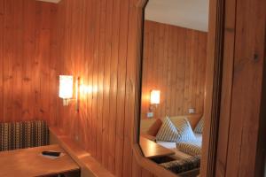 Postel nebo postele na pokoji v ubytování Albergo Alisander
