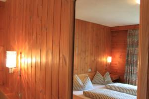 Postel nebo postele na pokoji v ubytování Albergo Alisander