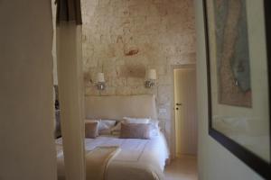 Posteľ alebo postele v izbe v ubytovaní Trulli La Pietraia