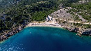 an aerial view of a beach and a bridge at Apartment Arte Vrbnik in Vrbnik