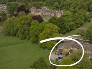 an aerial view of a house in a park at The Bailey Shepherd's Hut and Holiday Cottage in Skipton