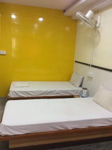 Postel nebo postele na pokoji v ubytování HOTEL SRI VAARI RESIDENCY