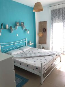 Ένα ή περισσότερα κρεβάτια σε δωμάτιο στο Plaka Luxury Villa