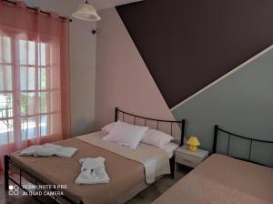 Postel nebo postele na pokoji v ubytování AK VILLAGE ROOMS