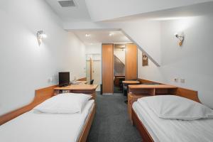 Posteľ alebo postele v izbe v ubytovaní Elita Hotel & Restauracja