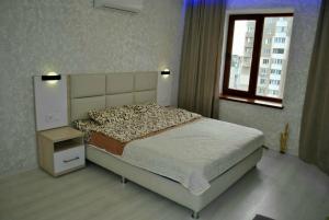 Ένα ή περισσότερα κρεβάτια σε δωμάτιο στο apart-hotel Sky