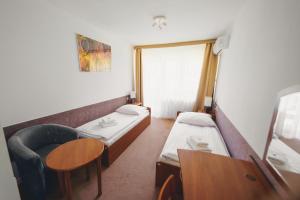 Posteľ alebo postele v izbe v ubytovaní Elita Hotel & Restauracja + 32 fotografií