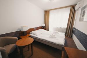 Posteľ alebo postele v izbe v ubytovaní Elita Hotel & Restauracja