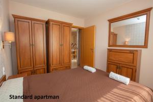 Postel nebo postele na pokoji v ubytování Liza Apartmanok + 12 fotografií