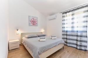 Ένα ή περισσότερα κρεβάτια σε δωμάτιο στο Villa Divsici 2105 +56 φωτογραφίες