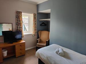 Ένα ή περισσότερα κρεβάτια σε δωμάτιο στο Richmond Arms Hotel