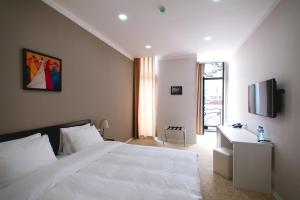A bed or beds in a room at Piazza Four Colours