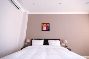 A bed or beds in a room at Piazza Four Colours