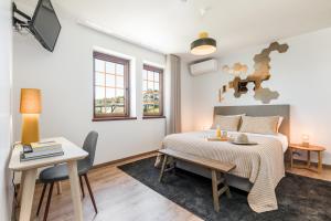 Postel nebo postele na pokoji v ubytování Estrela de Montesinho + 37 fotografií