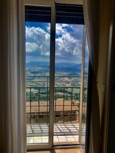 a window with a view of the countryside outside at Hotel Bellavista in San Marino