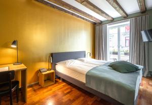 Postel nebo postele na pokoji v ubytování Hotel Rebstock