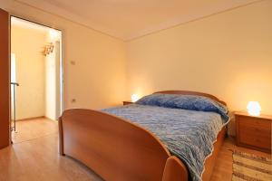 Postel nebo postele na pokoji v ubytování Apartments Bazjak + 2 fotografie