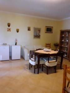 a living room with a table and a couch at BED & BREAKFAST Villa Cerasa in Case del Bevano +6 photos