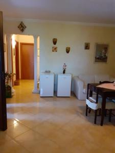 a living room with two refrigerators and a table at BED & BREAKFAST Villa Cerasa in Case del Bevano