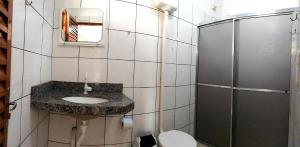 a bathroom with a sink and a shower at Pousada Jubaia in Bonito +48 photos