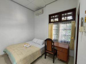 Postel nebo postele na pokoji v ubytování Ayodya Inn , Yogyakarta Lodging , Digital Nomads , Entrepreneurs Centre , CoWorking Space , CoLiving , Kost Lengkap , Exclusive Boarding House and Student Accommodation in Jogjakarta City Center !