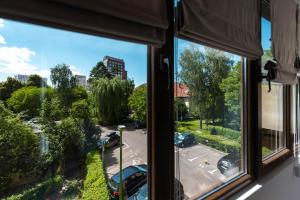 a view from a window of a parking lot at La Nueve Suite in Braşov