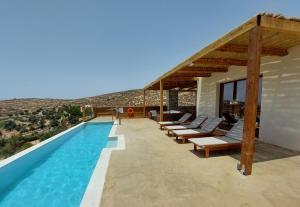 a villa with a swimming pool with a view at Phaestias Terra Villas in Kalamaki
