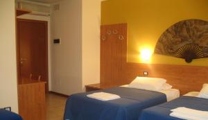 Postel nebo postele na pokoji v ubytování Laguna B&B
