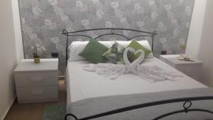 Postel nebo postele na pokoji v ubytování PONTE VALLE B&B POMPEI