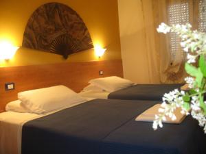 Postel nebo postele na pokoji v ubytování Laguna B&B