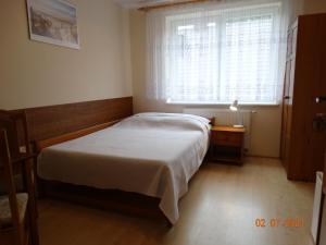 Postel nebo postele na pokoji v ubytování Niedaleko Morza