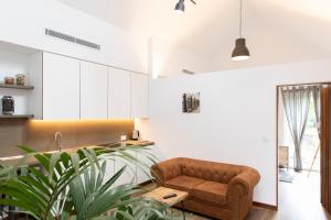 a living room with a couch and a table at Casitas de Madera O Loureiro in Noya