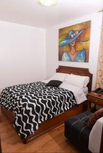 Voodi või voodid majutusasutuse Loreto hotel toas