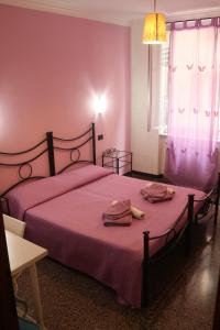 Ένα ή περισσότερα κρεβάτια σε δωμάτιο στο Bed & Breakfast La Rosa dei Venti