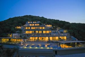 a large building on top of a hill at Azur Retreat in Meganisi