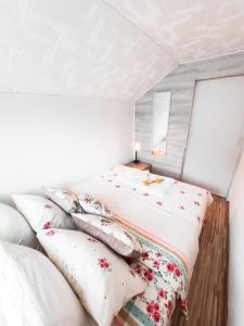 a bedroom with two beds and pillows at Holiday Home CASTLE in Bihać