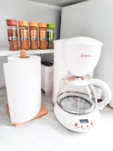 a white blender sitting on top of a counter at Holiday Home CASTLE in Bihać
