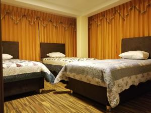 Postel nebo postele na pokoji v ubytování Hostal Inca