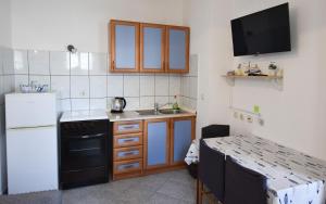 Kuchyň nebo kuchyňský kout v ubytování Apartment Murva