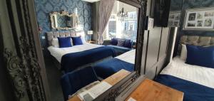 A bed or beds in a room at The Clifton 